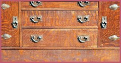 Drawer fronts and original hand-hammered hardware.